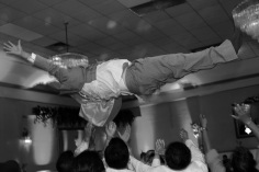 wedding-photos.wedding-photographer.groom-tossed-in-air.a-picturesque-memory-photography